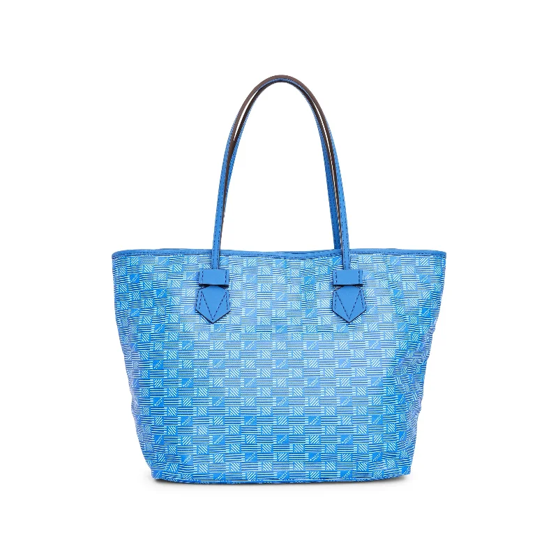 Bucket bags with faux fur accents for a fun and textured design for winter fashion-Saint Tropez Tote Bag MM in Blue