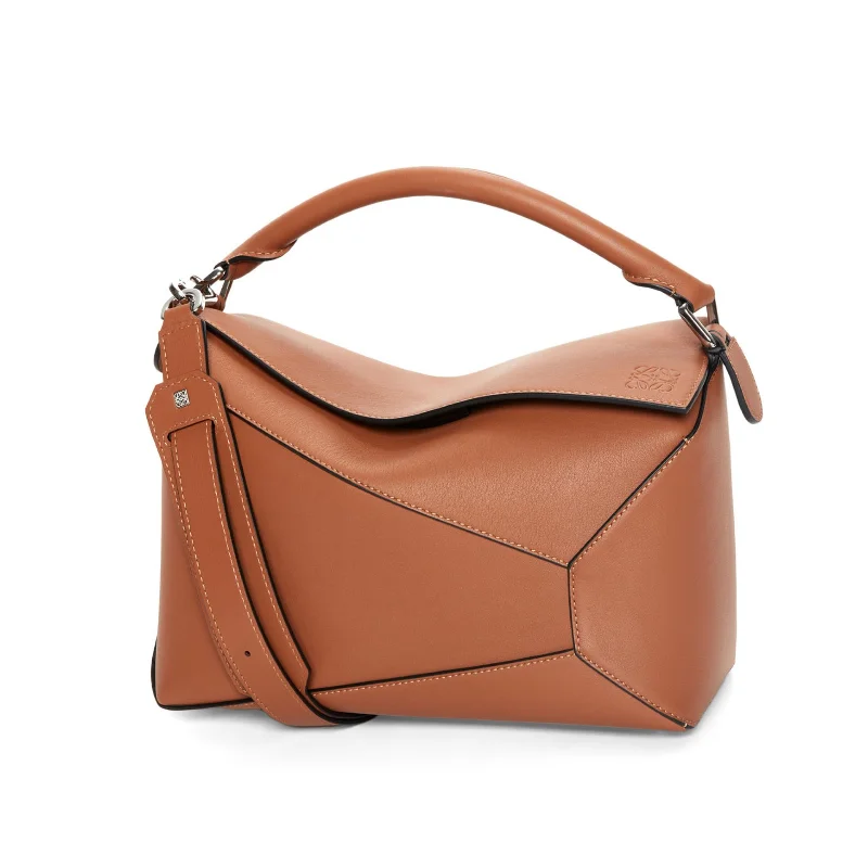 Luxury bucket bags with premium materials like suede and crocodile leather-Puzzle Edge Bag in Tan