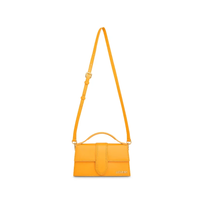 Bucket bags with polka dot patterns for a playful and retro-inspired accessory-Le Gran Bambino Leather Bag in Dark Orange